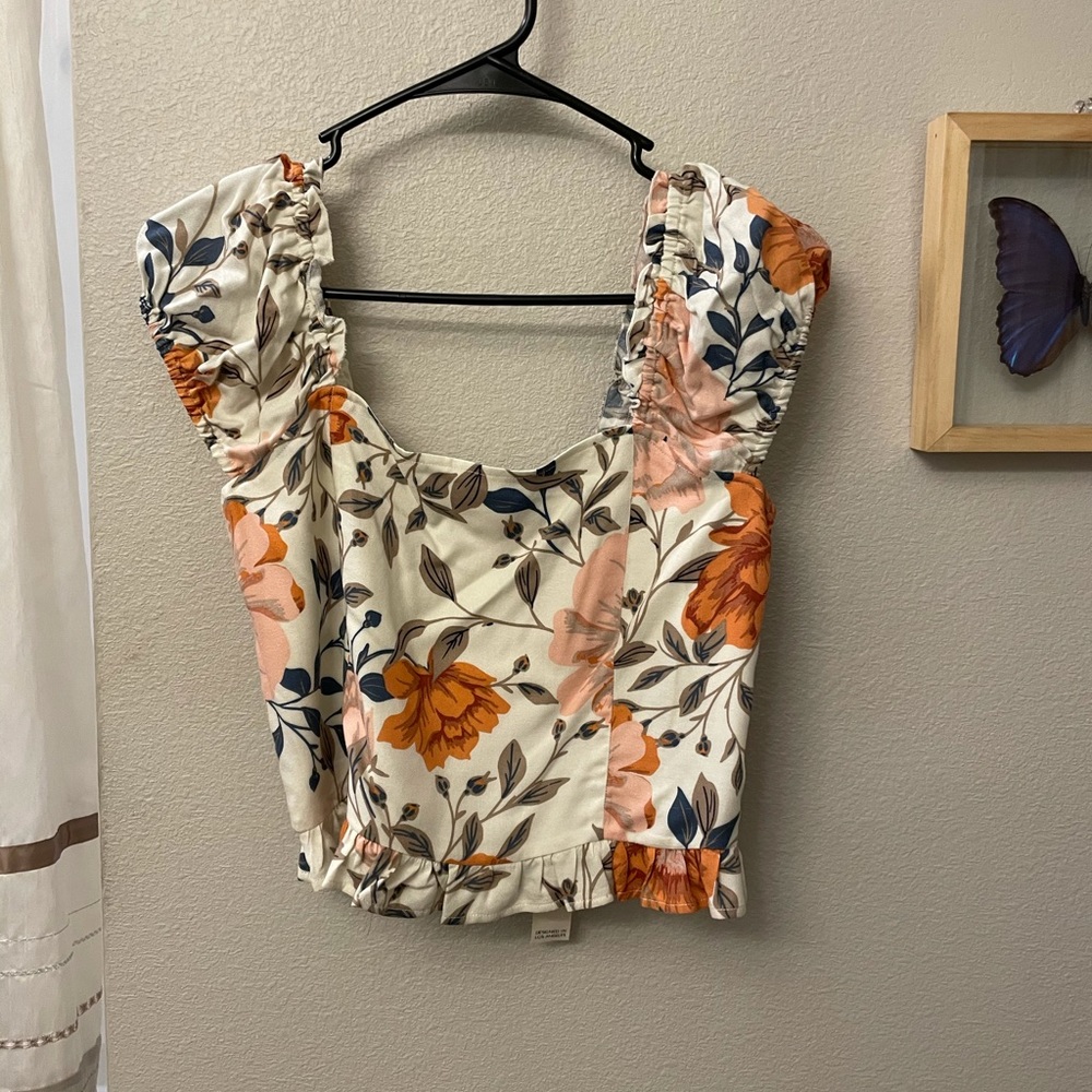 Cropped floral top with ruffle details
